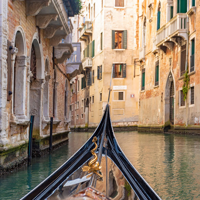 pov-from-a-gondola-on-a-canal-in-venice-italy-636×636